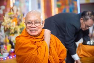 Giving food and prayer at Buddhist festival