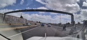 Bikies punch, kick L-plater riding on busy freeway