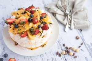 Cooking … Macadamia nut pavlova with mango and passionfruit